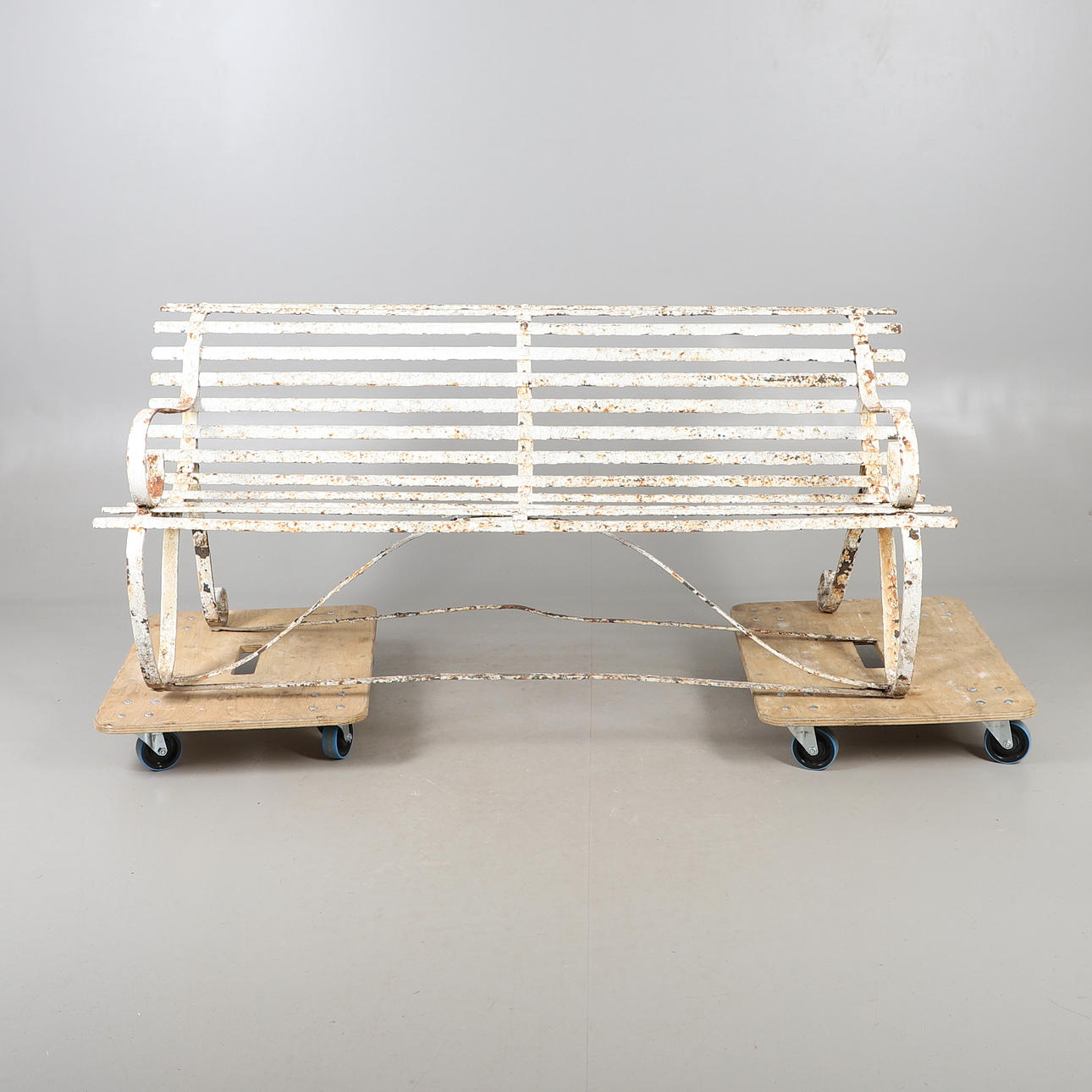 A PAINTED WROUGHT IRON STRAPWORK GARDEN BENCH.