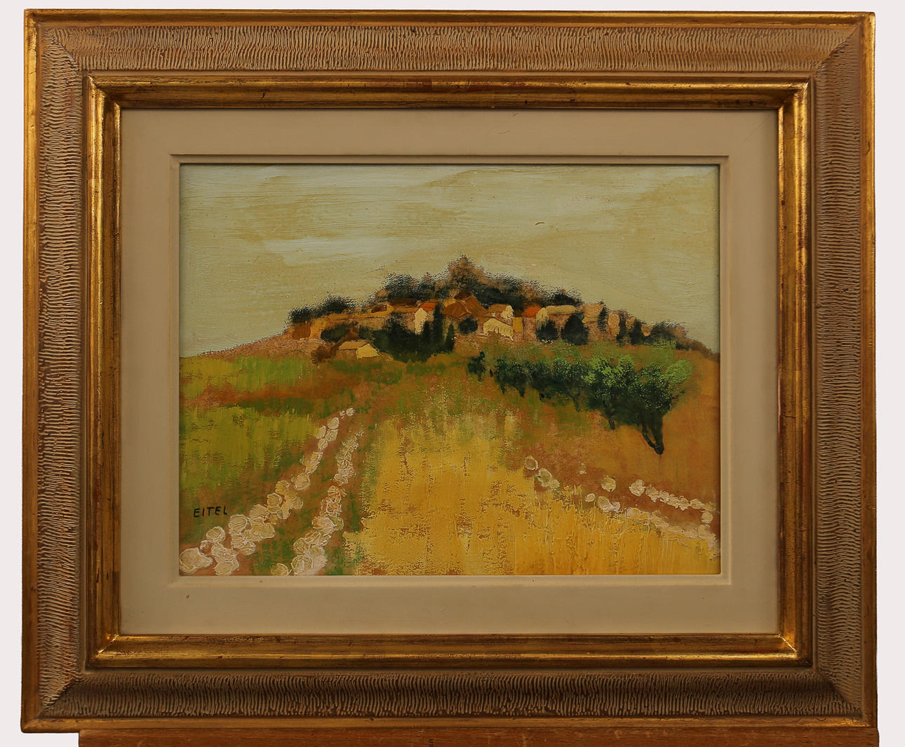 JACQUES EITEL. Oil on panel, village on a hill, signed.
