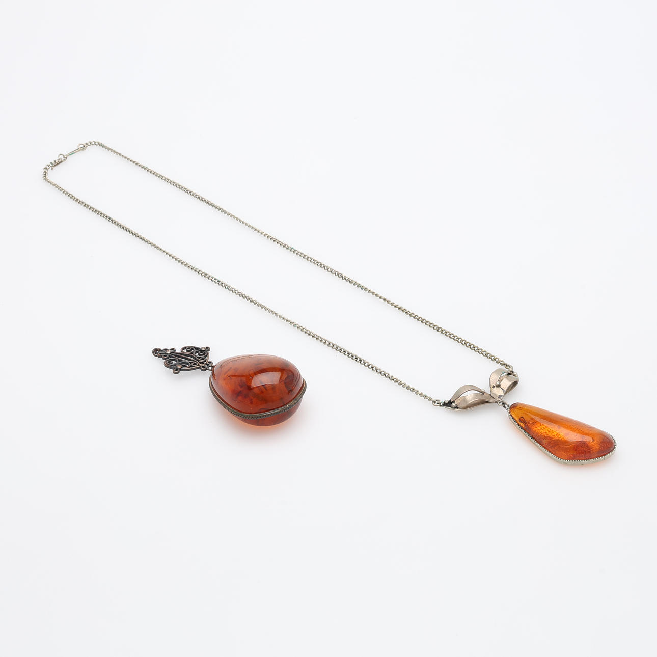 AMBER JEWELLERY, TWO PIECES.