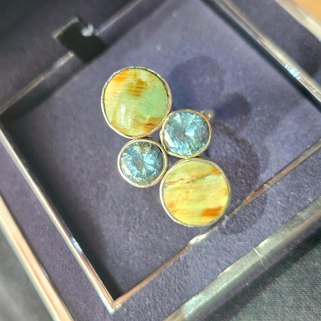 Silver ring with topazes and semi-precious stones.
