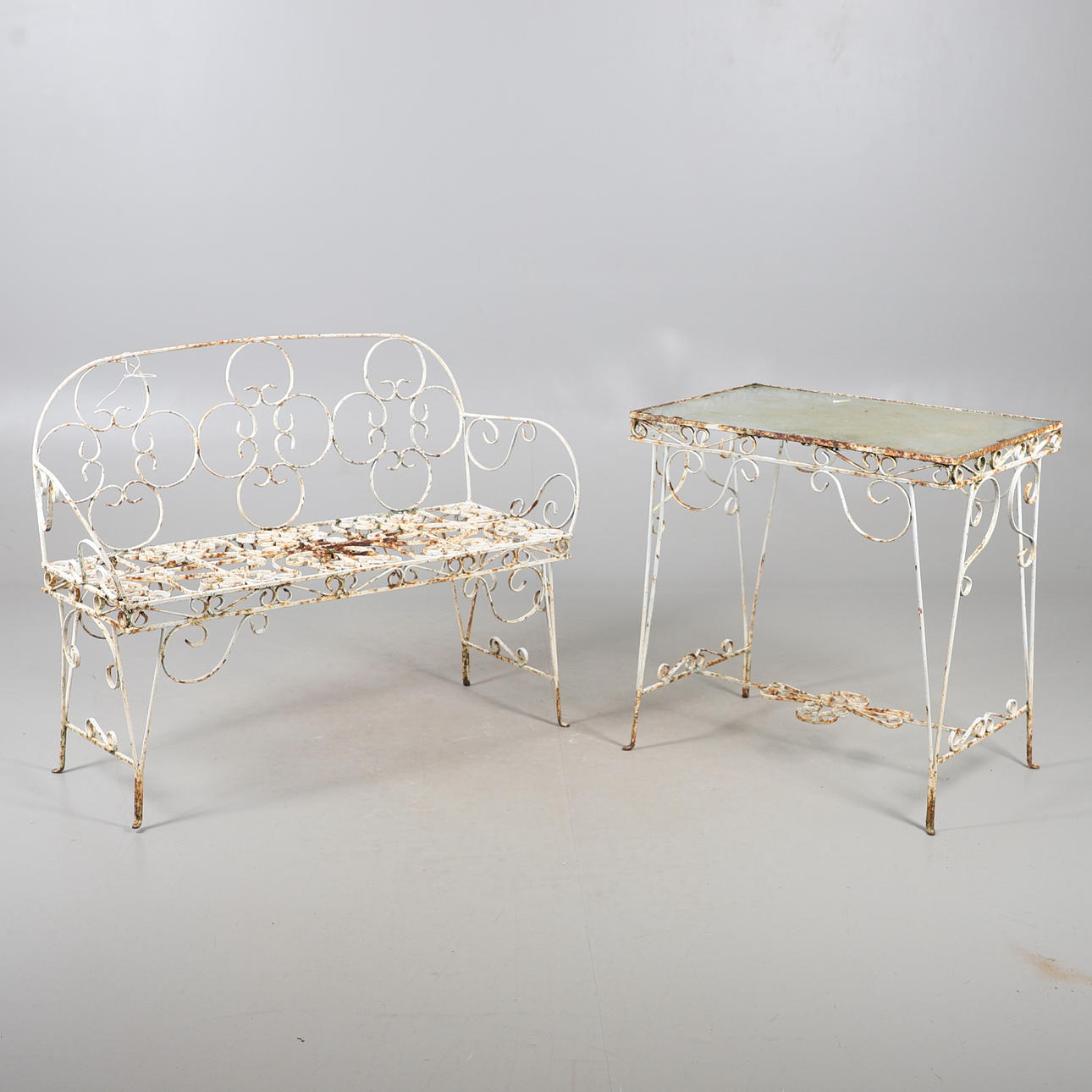 WROUGHT IRON GARDEN BENCH AND TABLE.