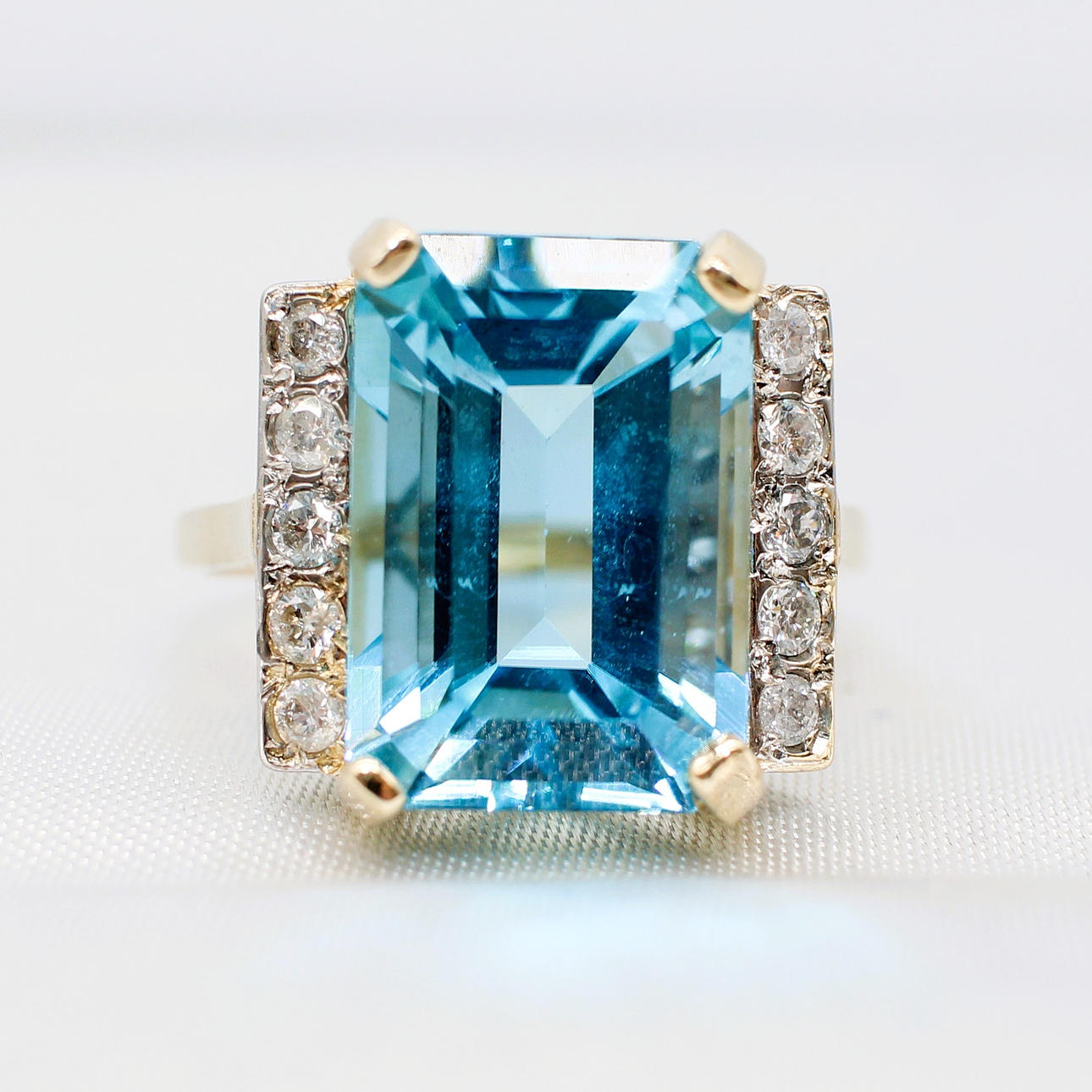 BLUE TOPAZ & DIAMOND DRESS RING.