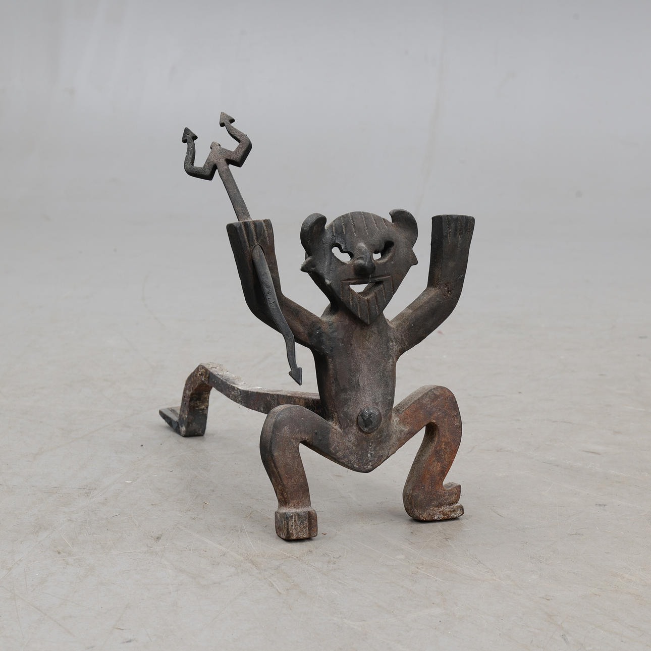 FIRE DOG, wrought iron, shaped as a devil.