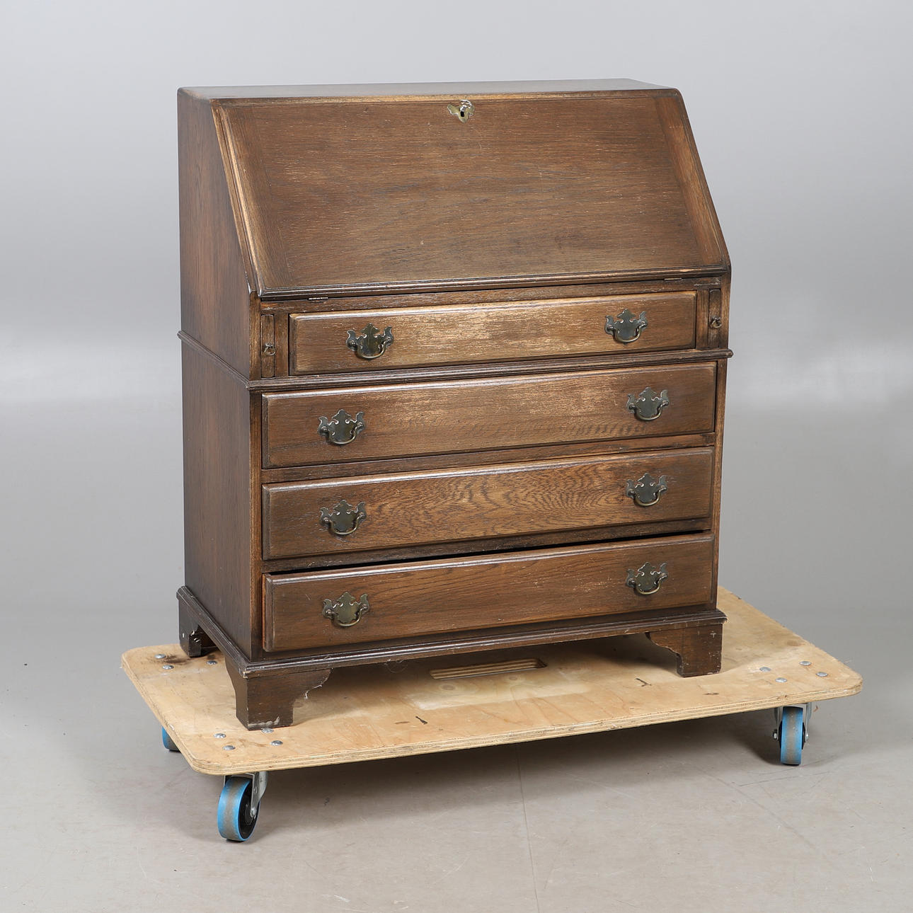AN OAK FINISH BUREAU.