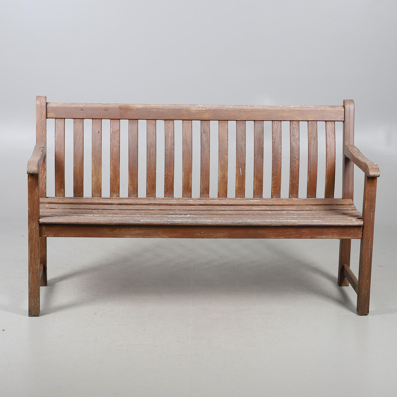A HARDWOOD GARDEN BENCH.