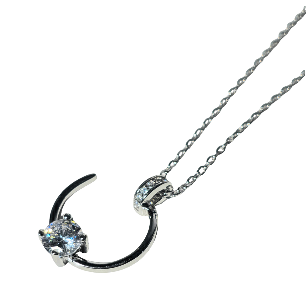 Silver and cubic zirconia necklace.