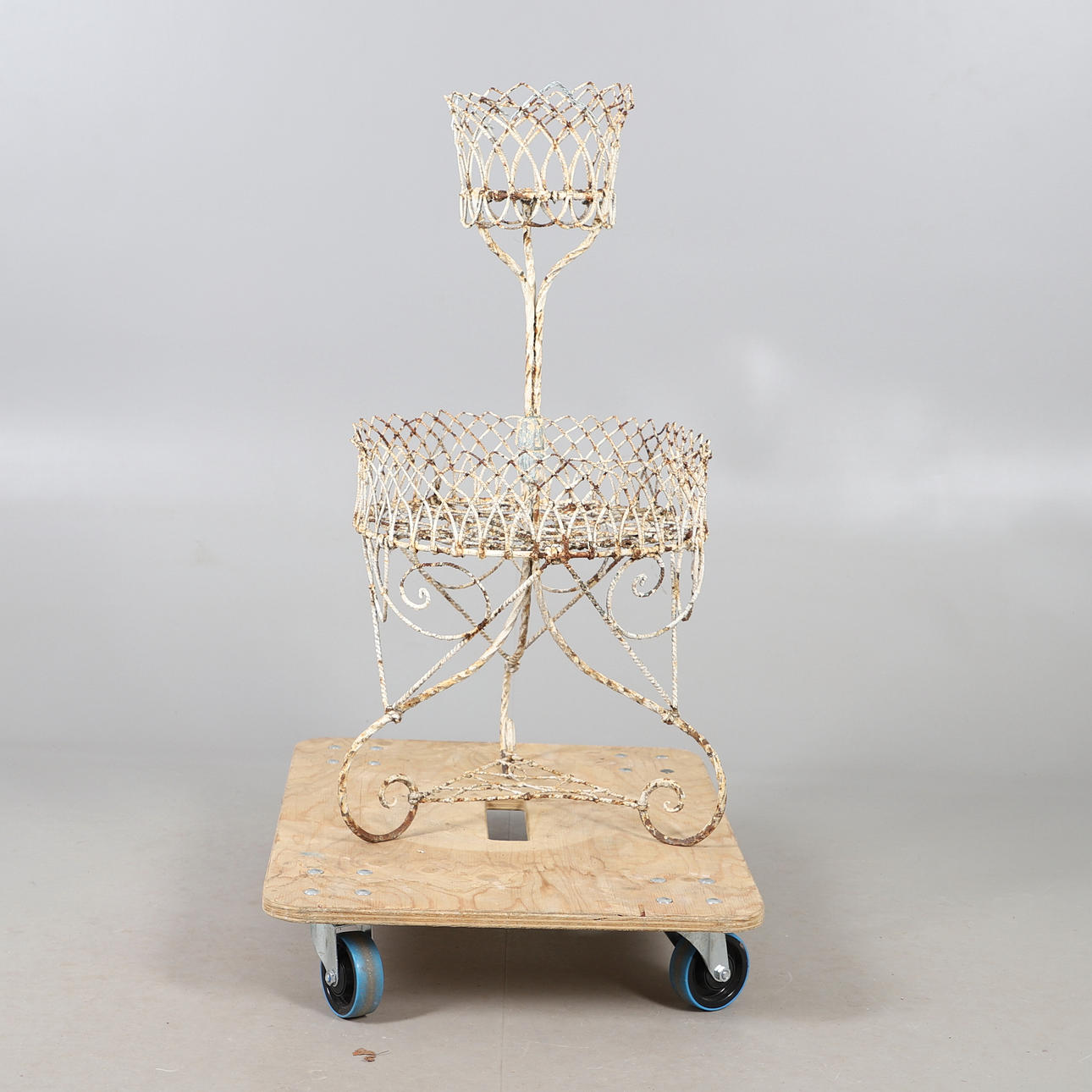 AN ANTIQUE PAINTED WIRE-WORK TWO TIER POT STAND.