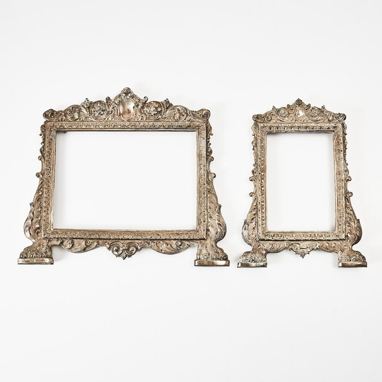 FRAMES, 1 pair, Baroque style, nickel silver with wooden backs.