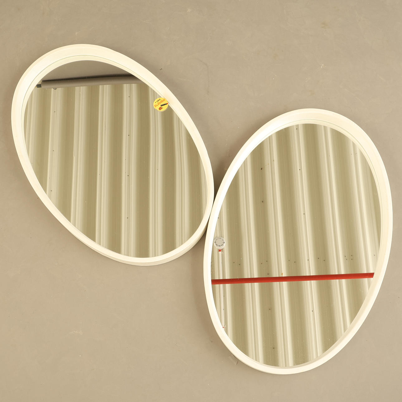 MIRRORS, a pair, oval, contemporary.