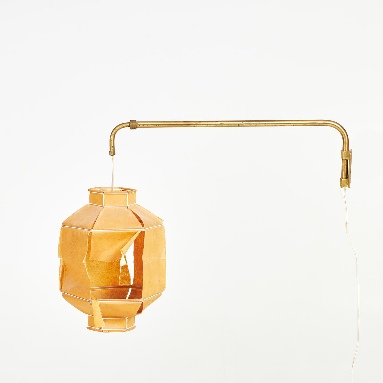 WALL LAMP. Brass frame, paper shade, 1950s/60s.