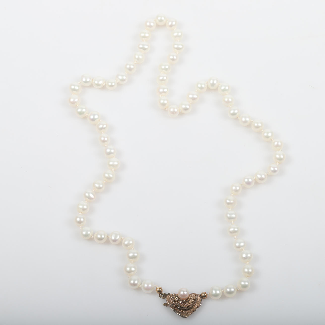 NECKLACE, shell pearls with sterling silver clasp.