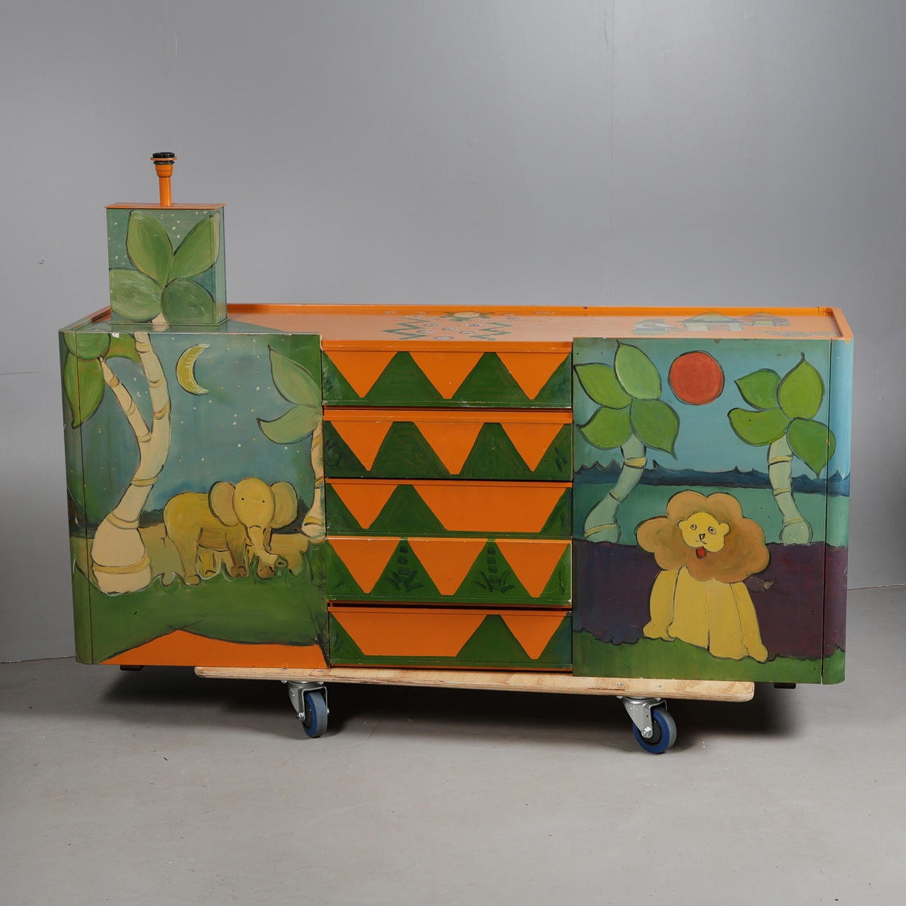 A BRIGHTLY PAINTED SIDEBOARD AND MATCHING LAMP (2).