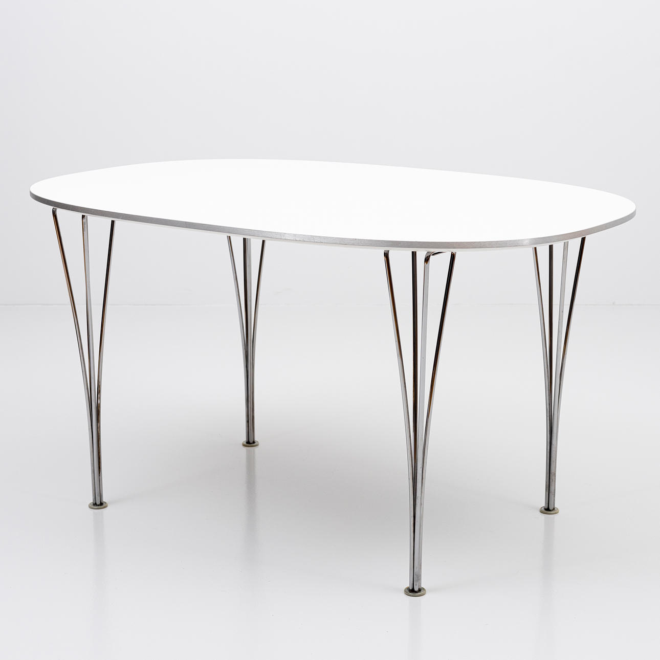 PIET HEIN, BRUNO MATHSSON & ARNE JACOBSEN. Dining table, "Superellips" model B611, labelled, Fritz Hansen, Denmark, 2018.