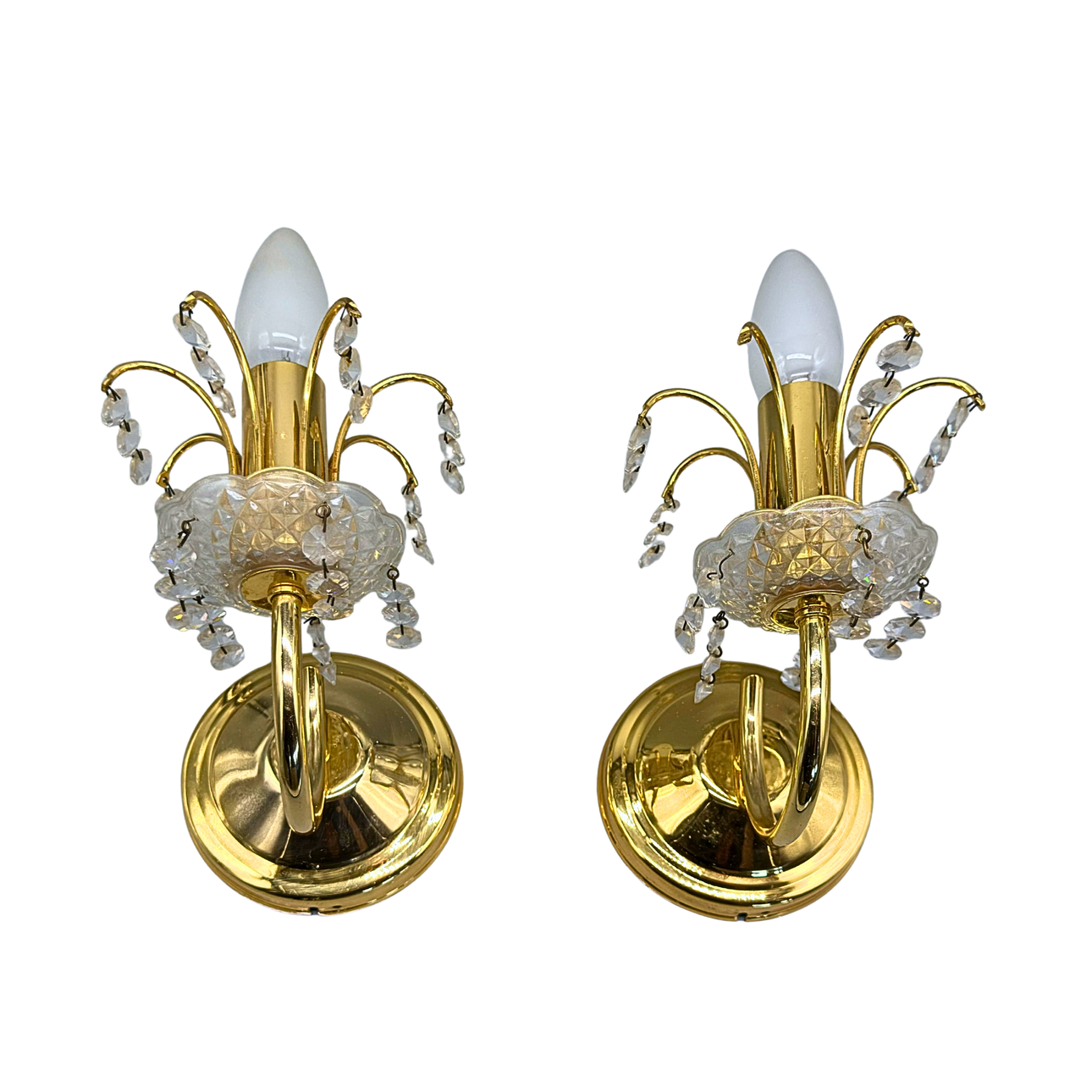 TWO MID-CENTURY BRASS WALL SCONCES WITH CRYSTAL DROPS.