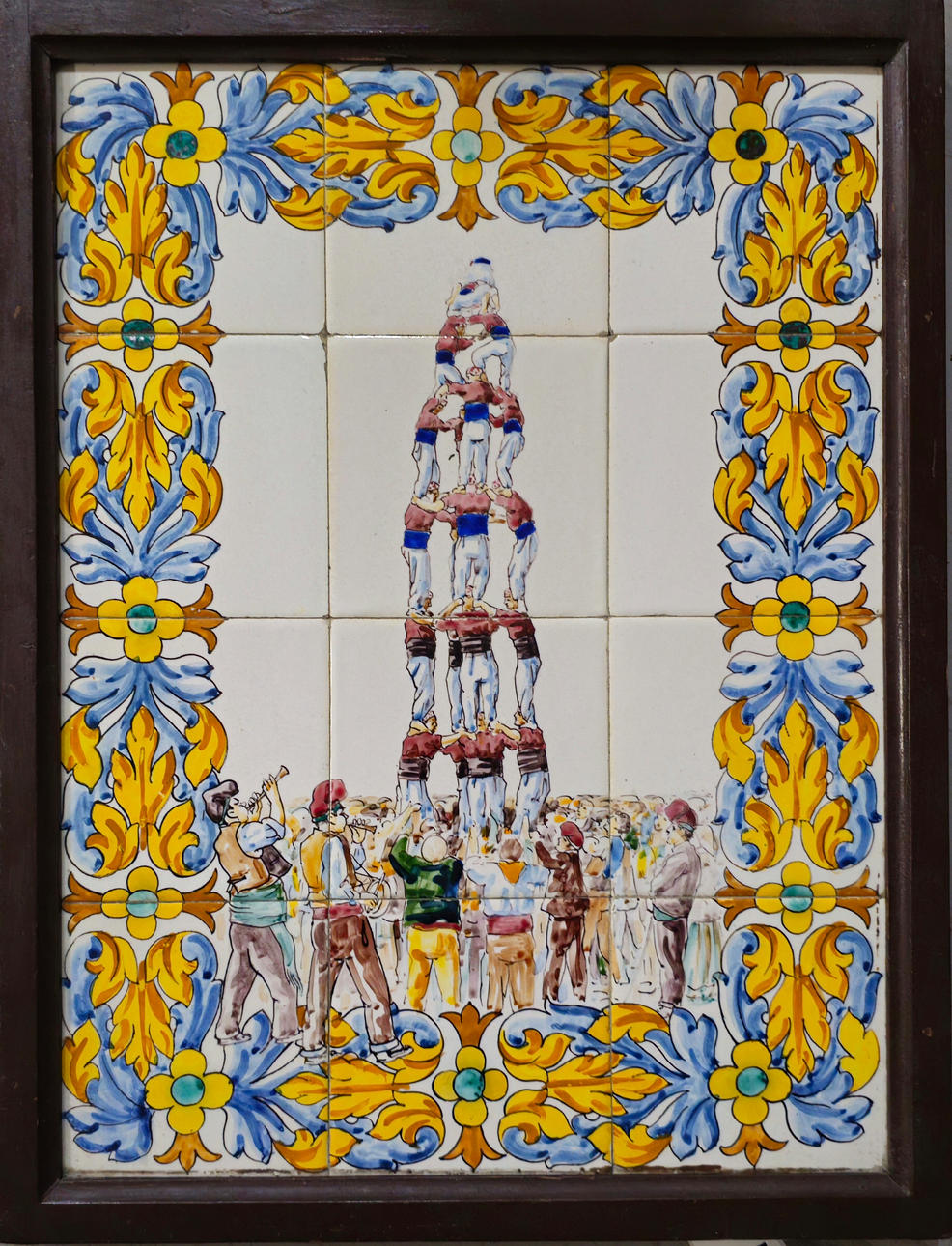 Framed tiles depicting "Els castellers".