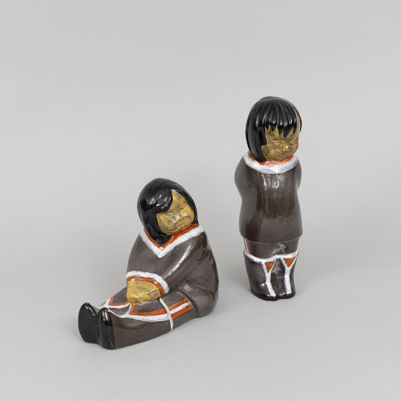 VICKE LINDSTRAND. Figurines, 2 pcs, Eskimos, glazed earthenware, Upsala Ekeby, signed.