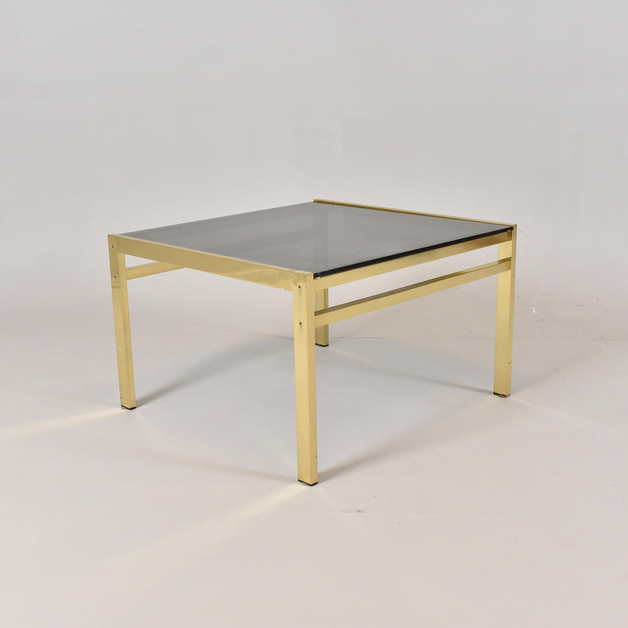 COFFEE TABLE, brass with tinted glass top.