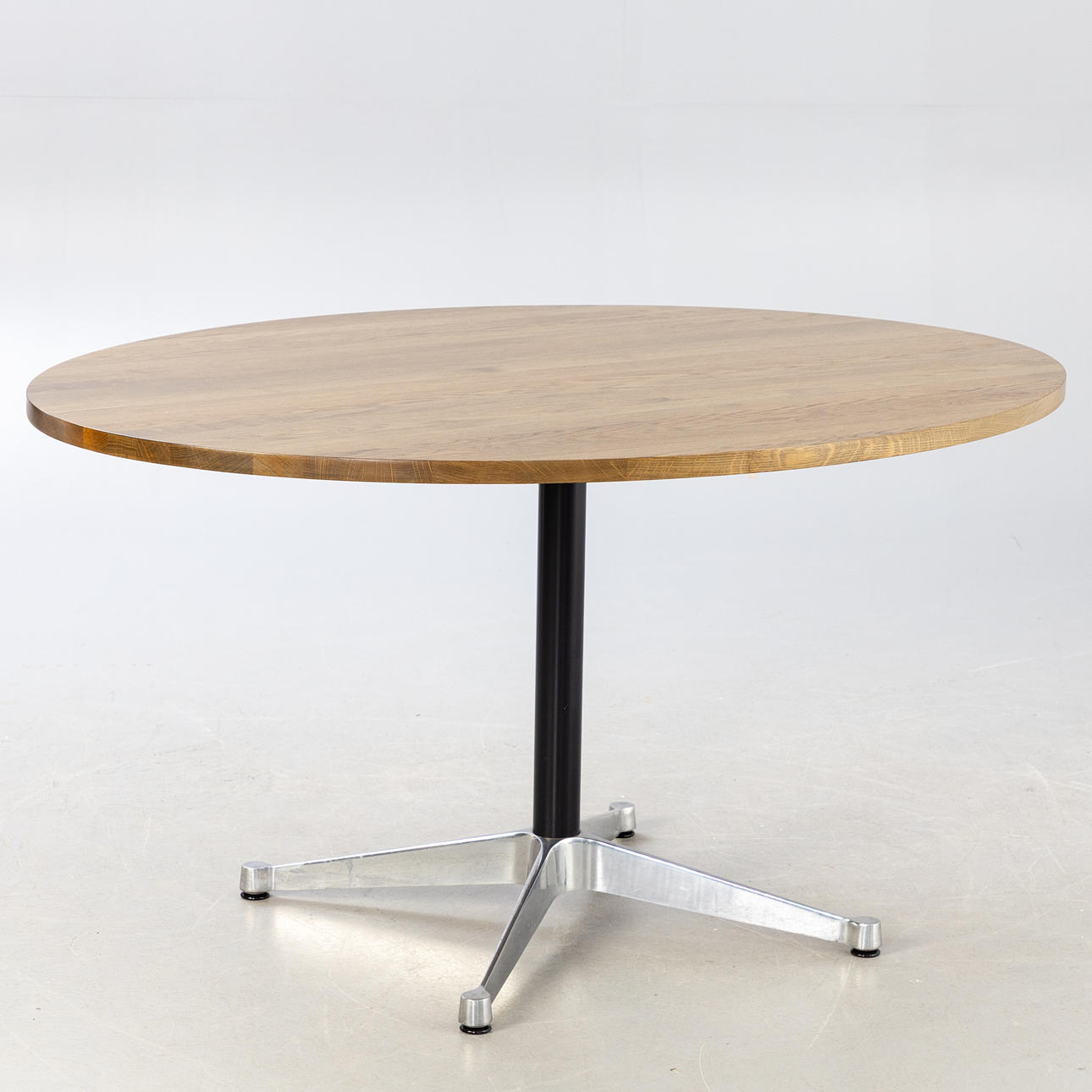 Oval oak table with CHARLES & RAY EAMES 'Contract' base.