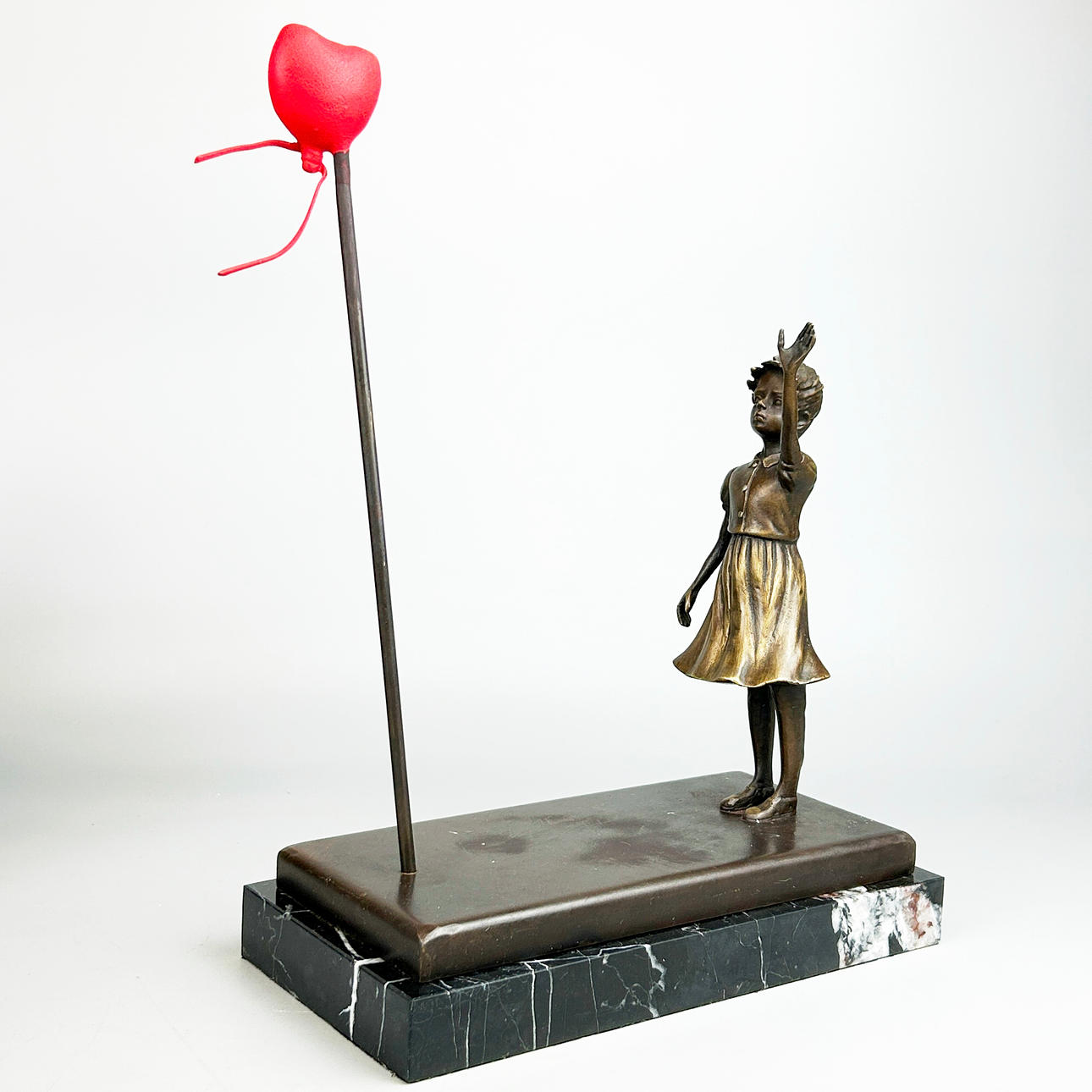 BRONZE BANKSY STYLE FIGURE.