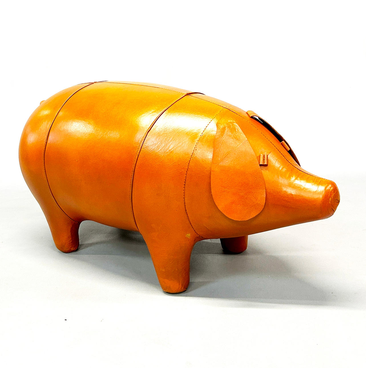 TAN LEATHER PIG STOOL.