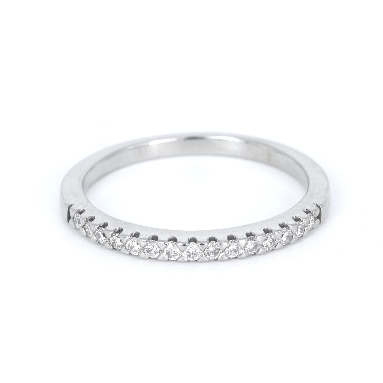 PLATINUM DIAMOND HALF ETERNITY RING.
