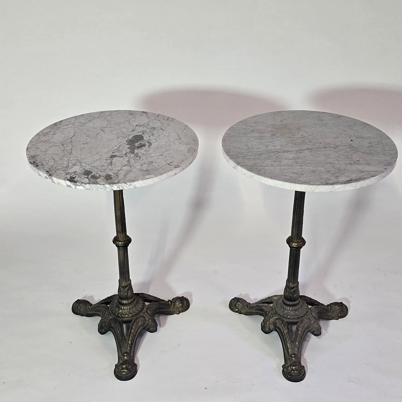 Two bistro tables, marble top.