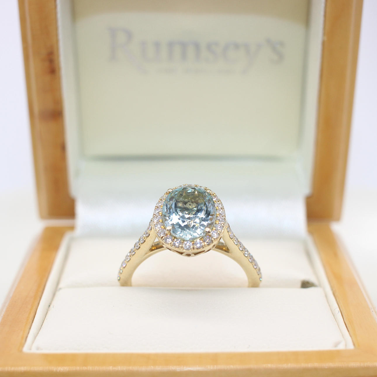 AQUAMARINE & DIAMOND HALO RING.