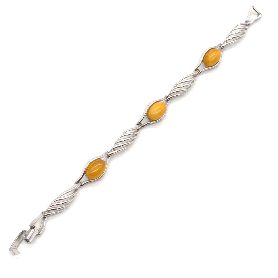 DESIGNER BRACELET 800 SILVER, OPENWORK SETTING, SET WITH 3 BUTTERSCOTCH AMBER CABOCHONS, HALLMARKED, WITH MAKER'S MARK, CIRCA 1960.