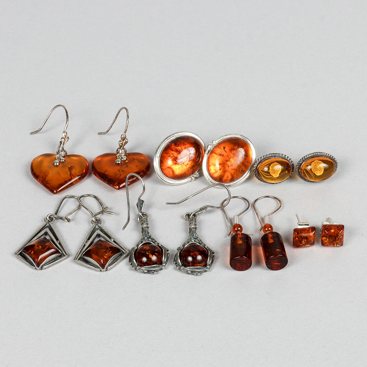 EARRINGS 6 pairs, silver and amber.