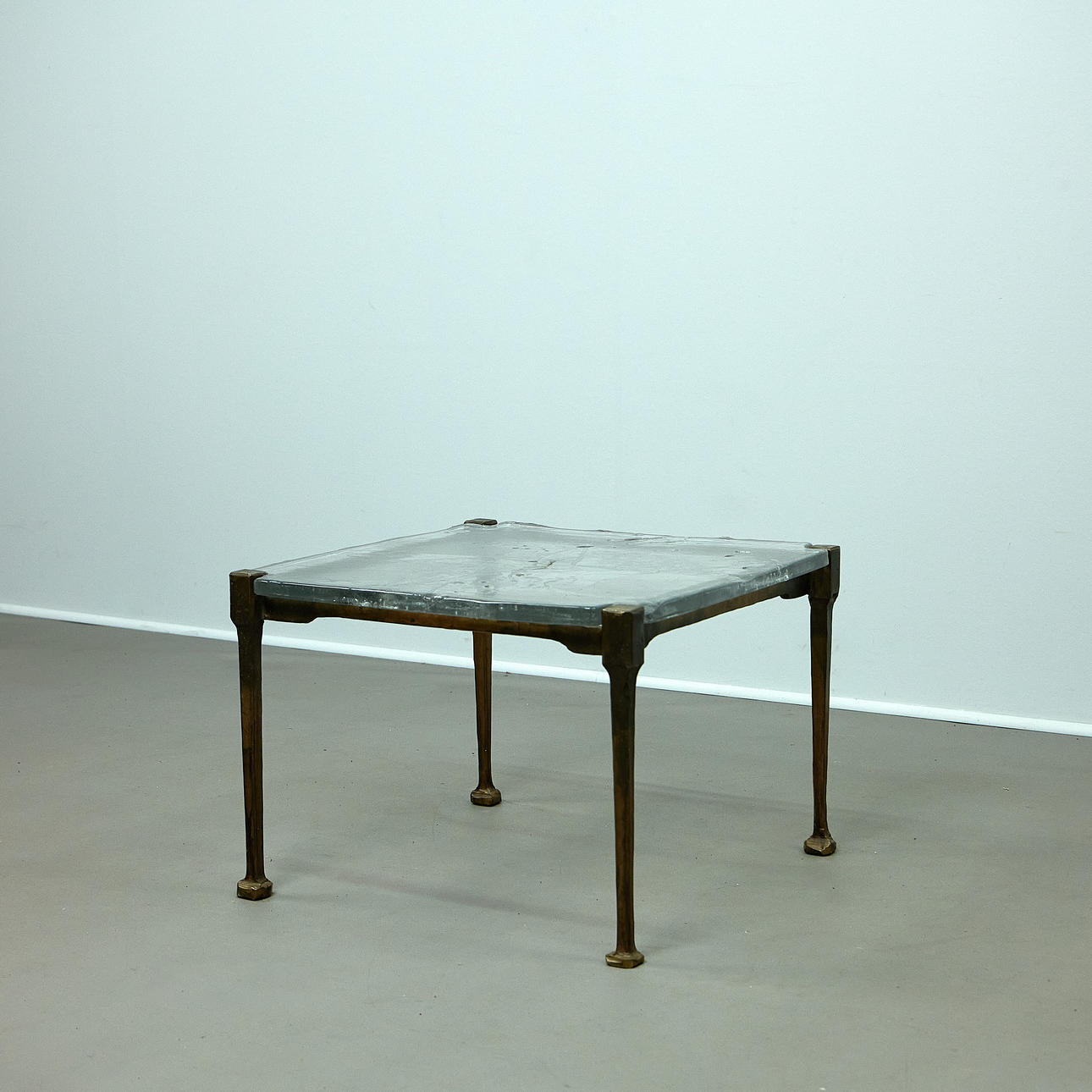LOTHAR KLUTE. Coffee table / side table, bronze, glass, signed 1983, Germany.