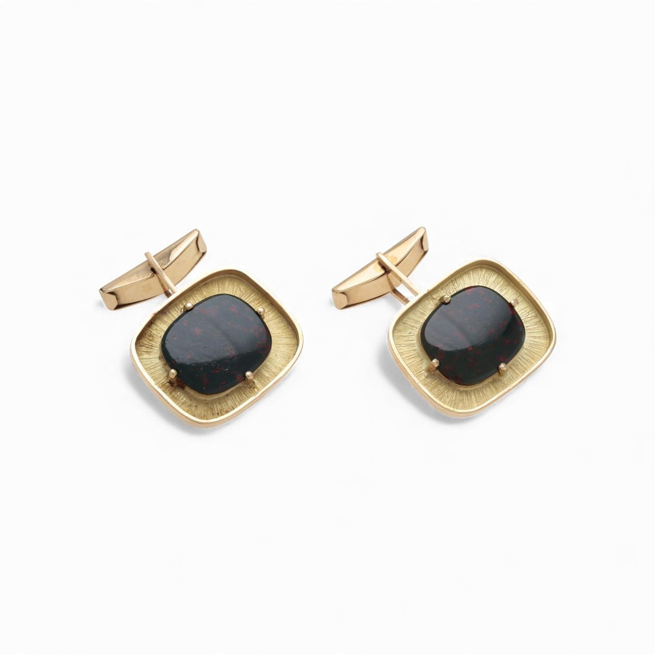 Cufflinks in matte gold and gemstones.