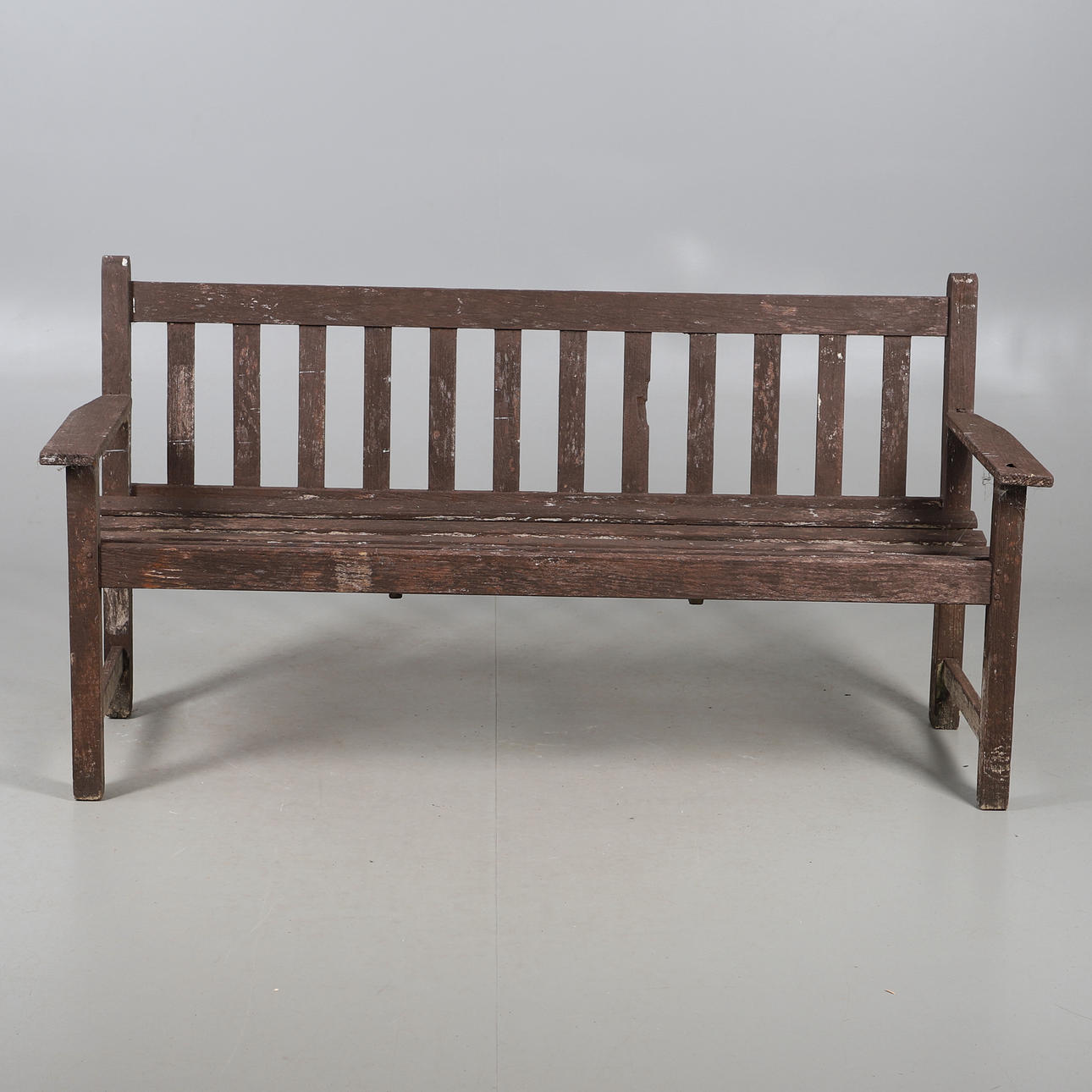 A PAINTED GARDEN BENCH.