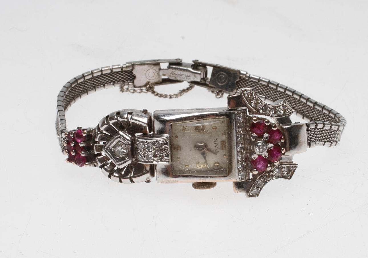 DAMARMBANDSUR NIVIA, 14k vitguld, med diamanter och rubiner, armband stål.