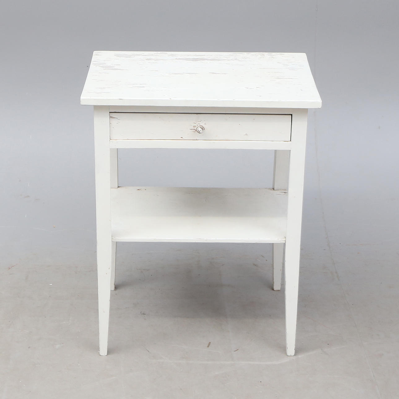 Small table with drawer, circa 1900.