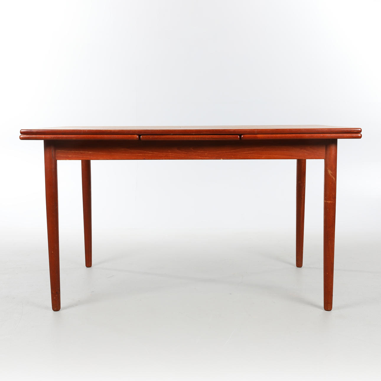DANSK DESIGN. Dining table in teak with pull-out leaves, 1960s.