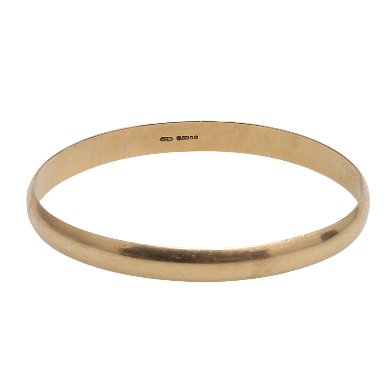 A LATE 20TH CENTURY 9CT GOLD BANGLE.