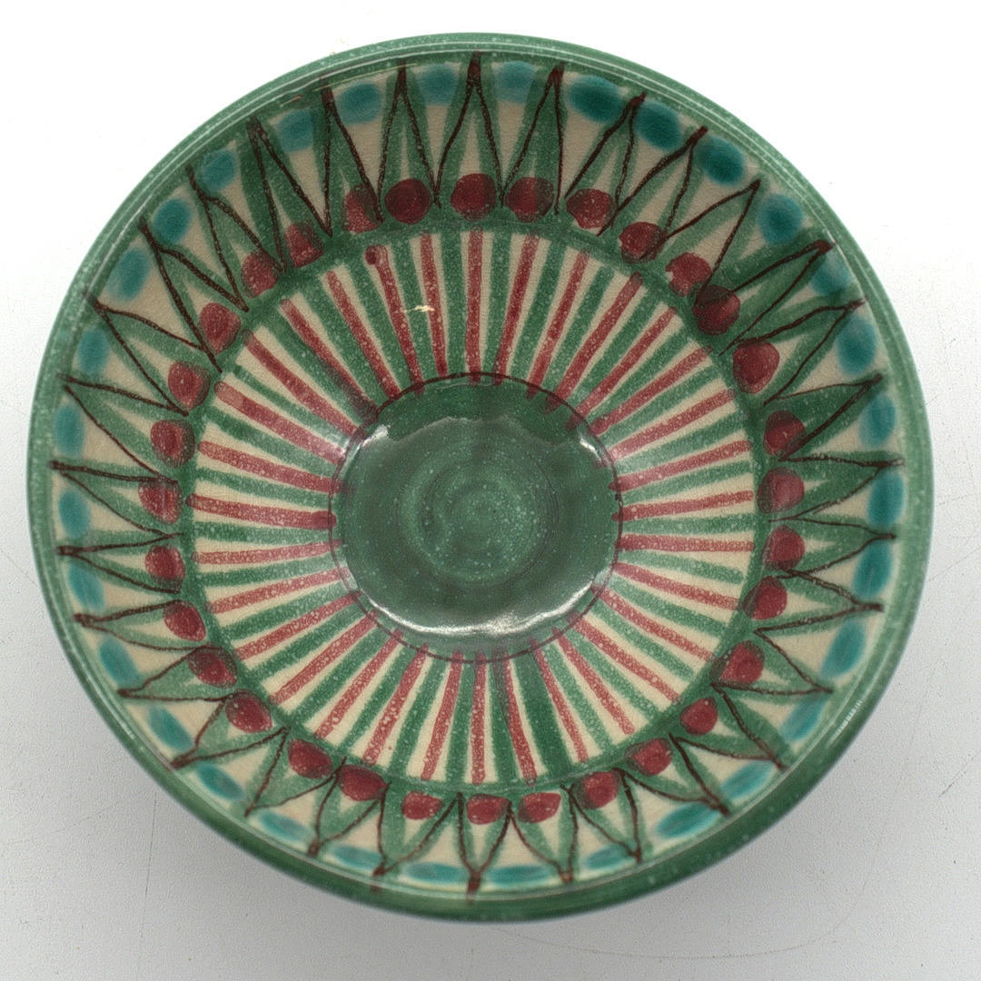 DESIGNER CERAMIC BOWL WITH RED GREEN GLAZE.