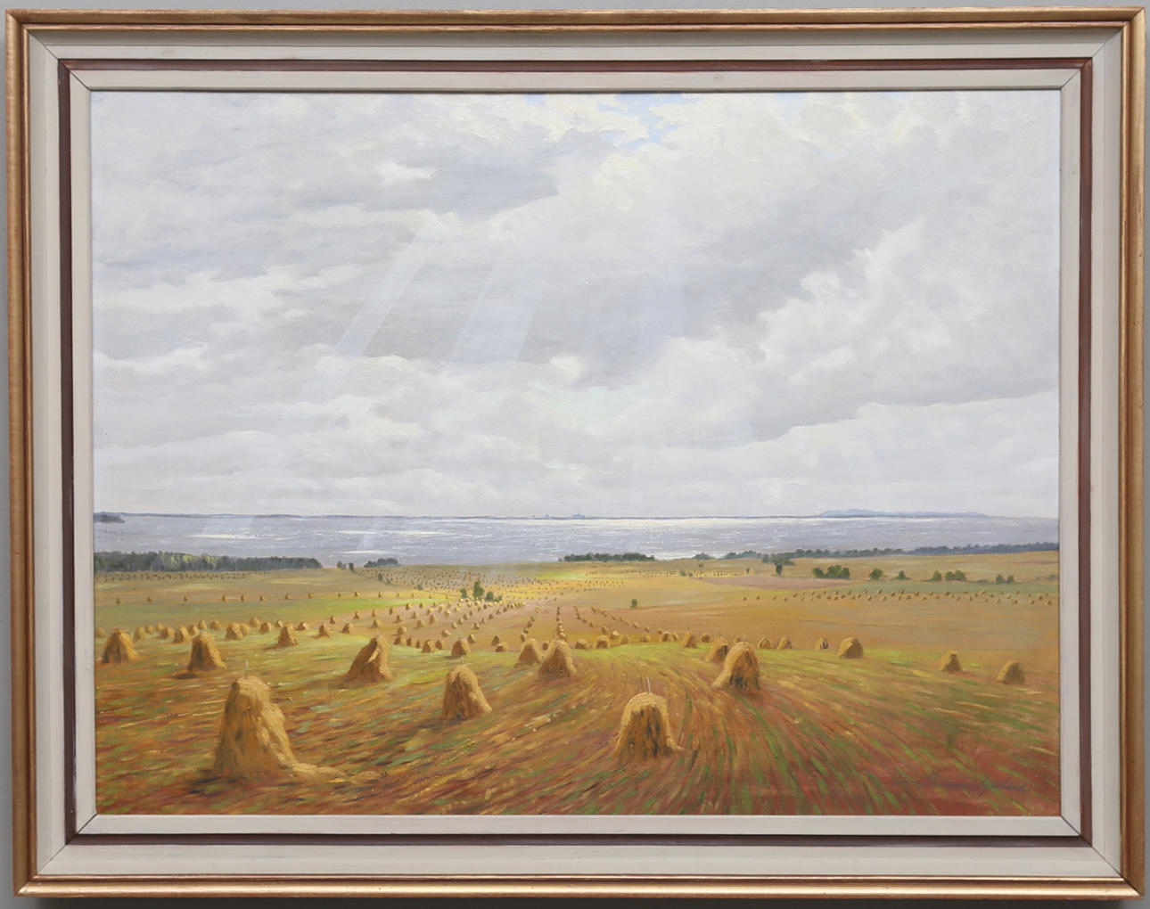 BIRGER HJELM. "Skörd vid Vättern(Djurkälla)". Olja på pannå, signerad.
