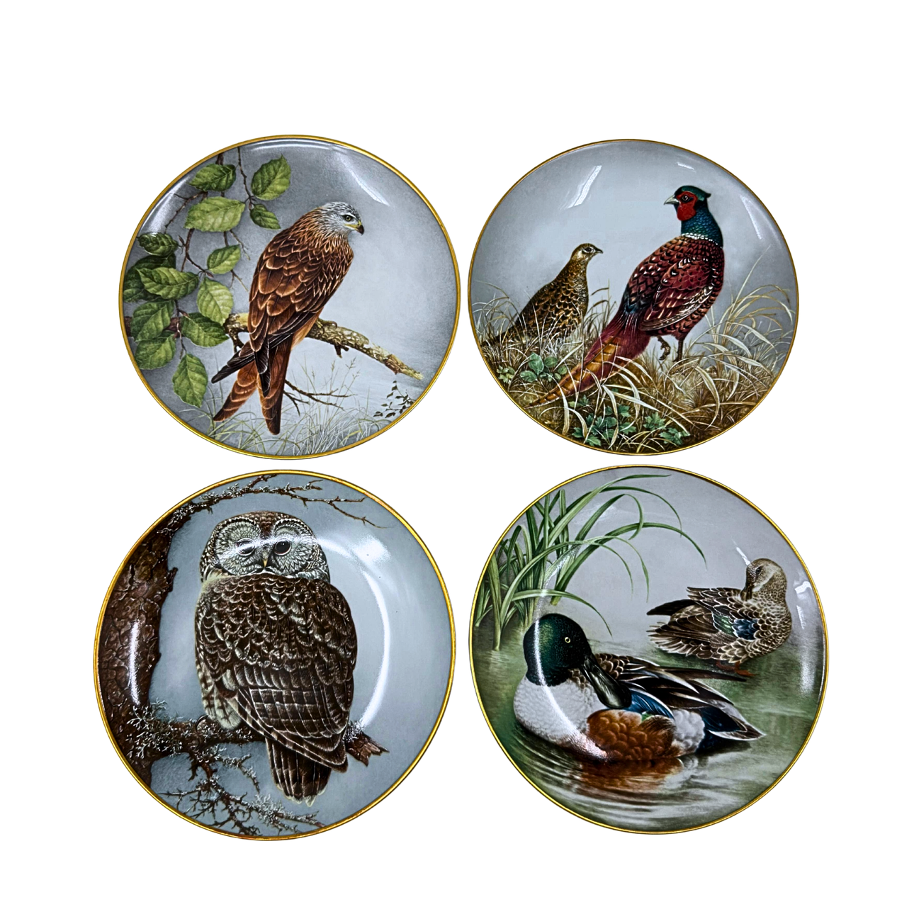 FRANKLIN MINT. FYRA PORSLINSSAMLARTALLRIKAR MED OLIKA DJURMOTIV OCH GULDKANT