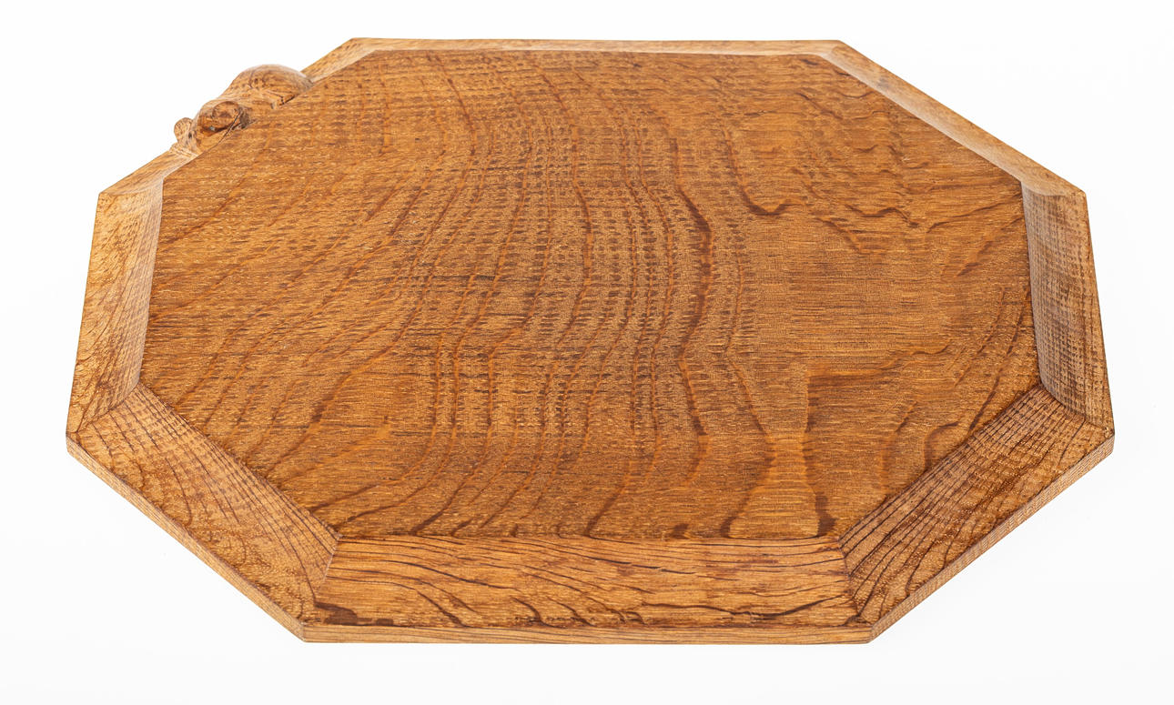 ROBERT MOUSEMAN THOMPSON (1876-1955). WORKSHOP OF ROBERT MOUSEMAN THOMPSON (1876-1955), CARVED OAK CHOPPING BOARD.