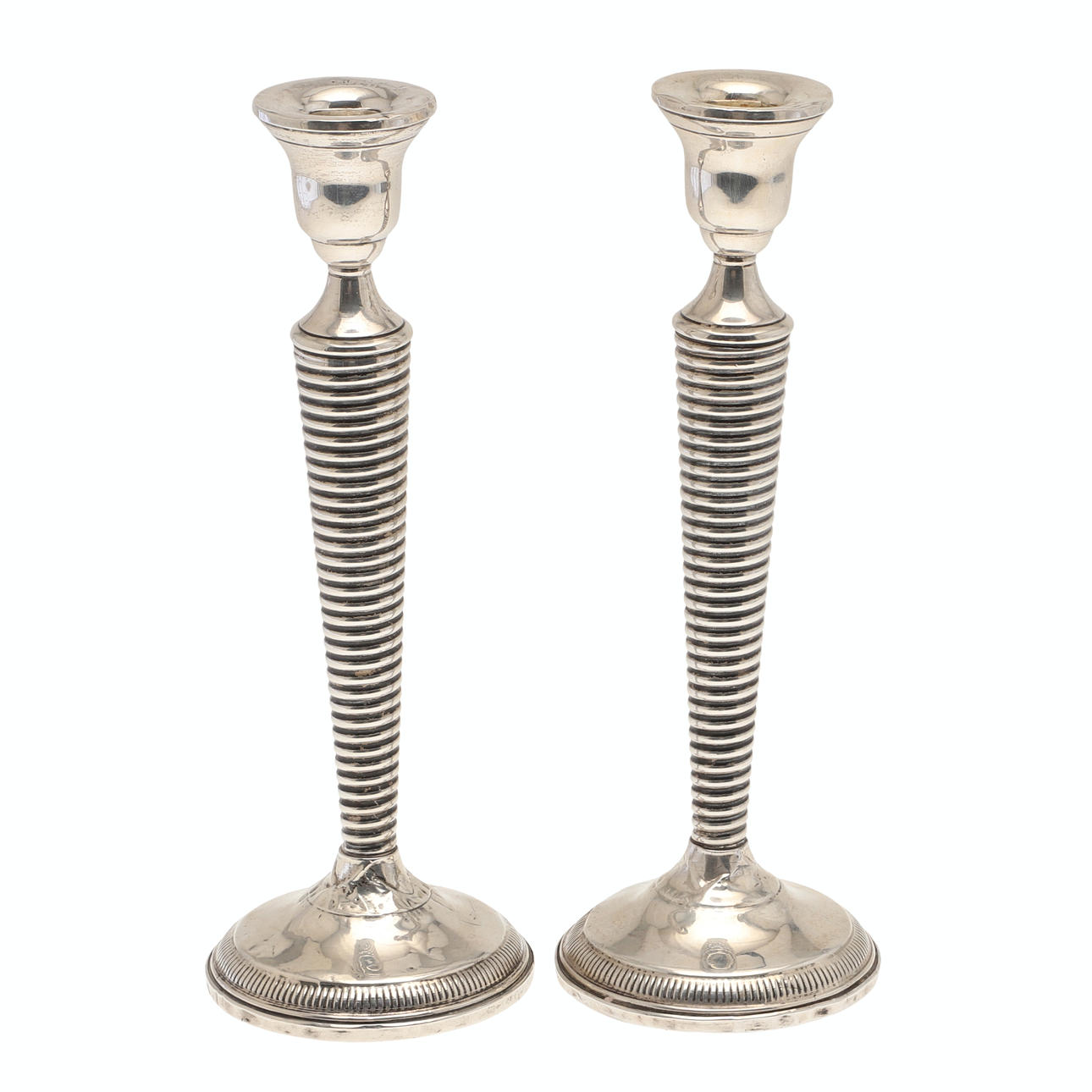 A PAIR OF WEIGHTED SILVER CANDLESTICKS.