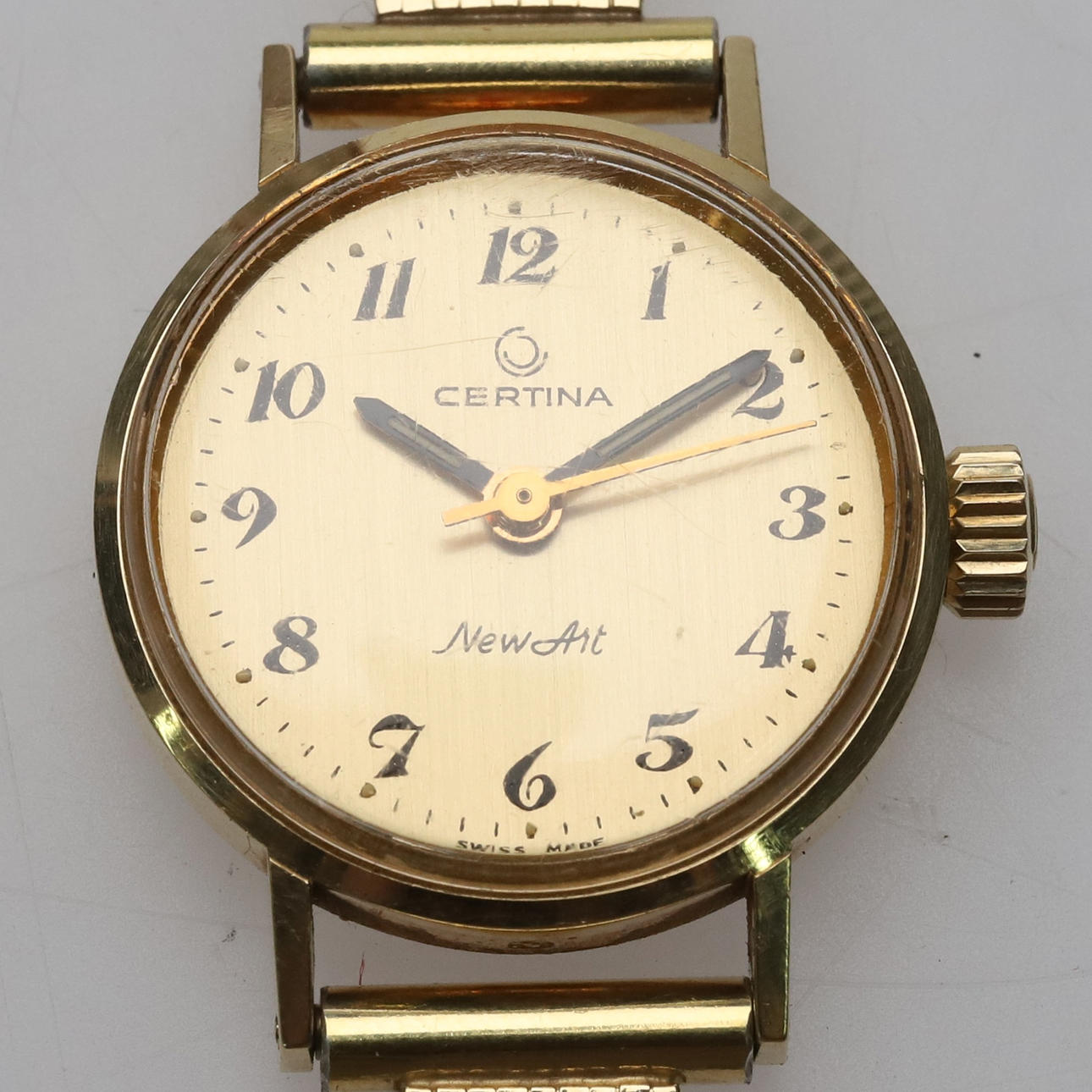 CERTINA. 14k gold, silver bracelet, manual.
