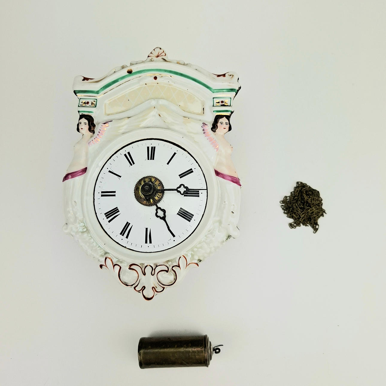 WALL CLOCK, porcelain and wood, circa 1900.