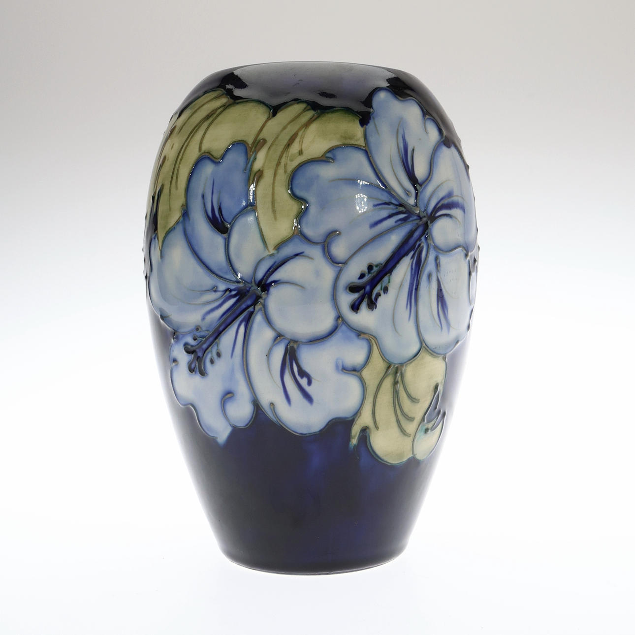 WILLIAM J MOORCROFT HIBISCUS PATTERN OVOID VASE.