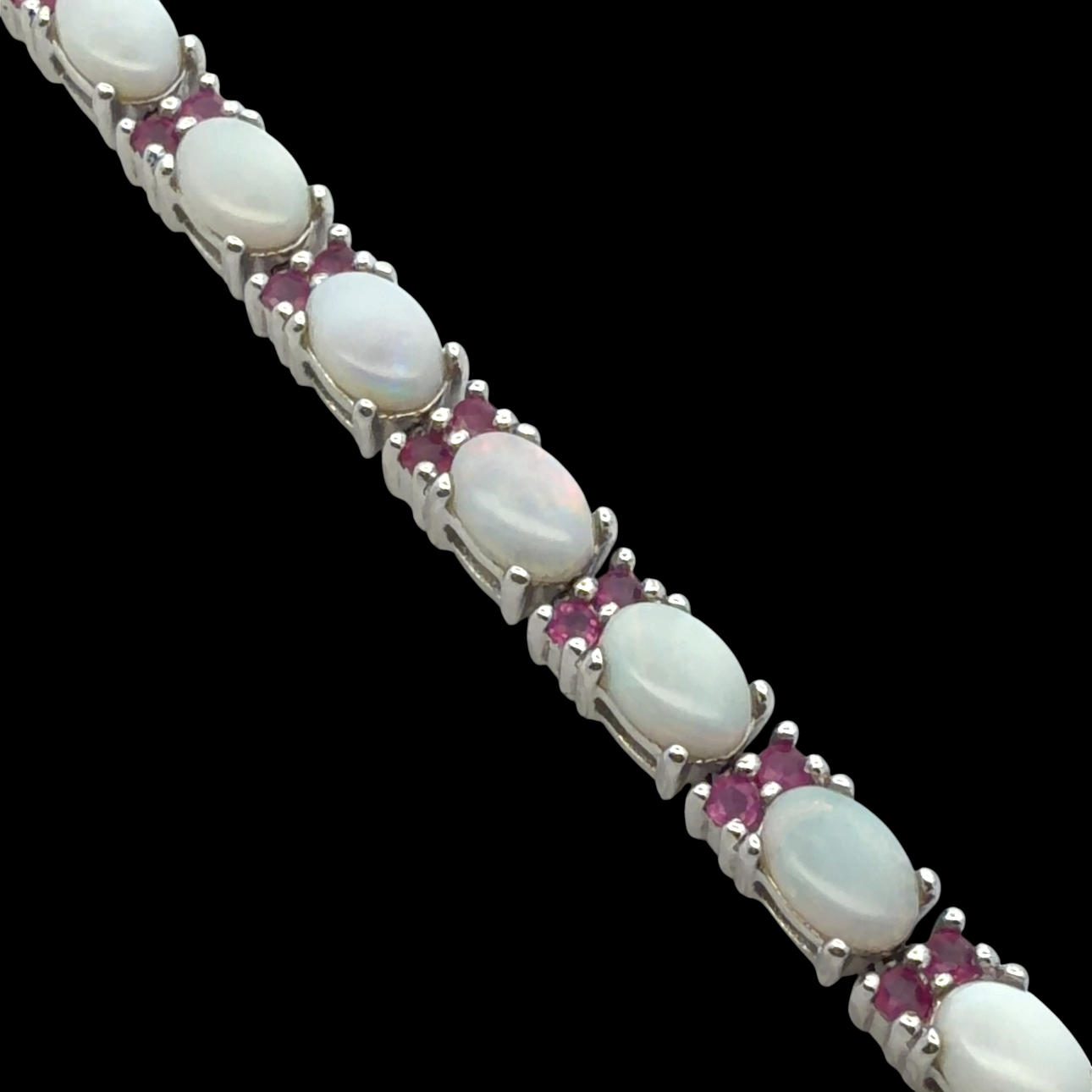 OPAL AND RUBY SILVER BRACELET.