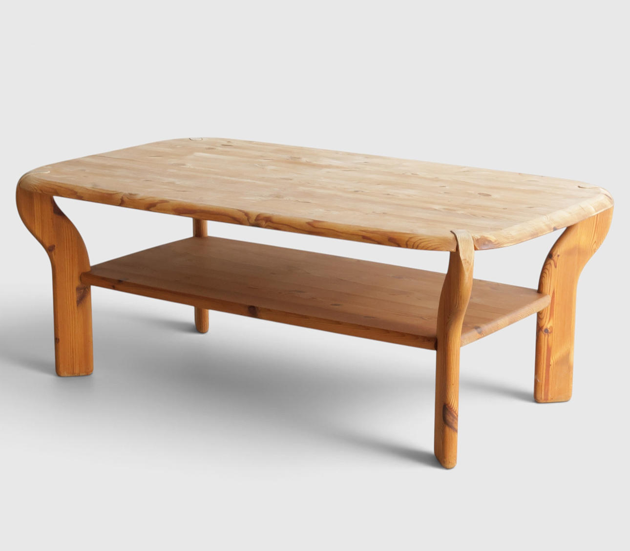 Rectangular coffee table in solid pine, sculptural curved legs. Scandinavia, 1970s.