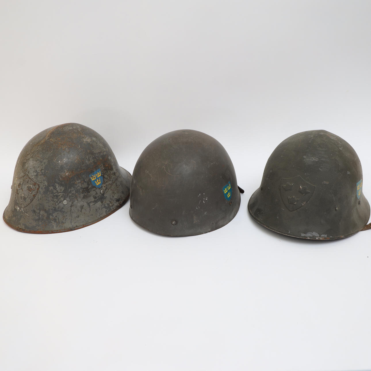 HELMETS 3 pcs, 20th century, metal, interior with leather.