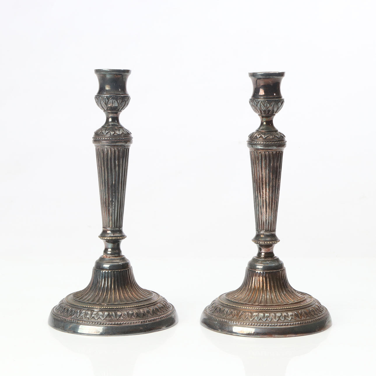 CANDLESTICKS, A PAIR. Nickel silver. 19th century.