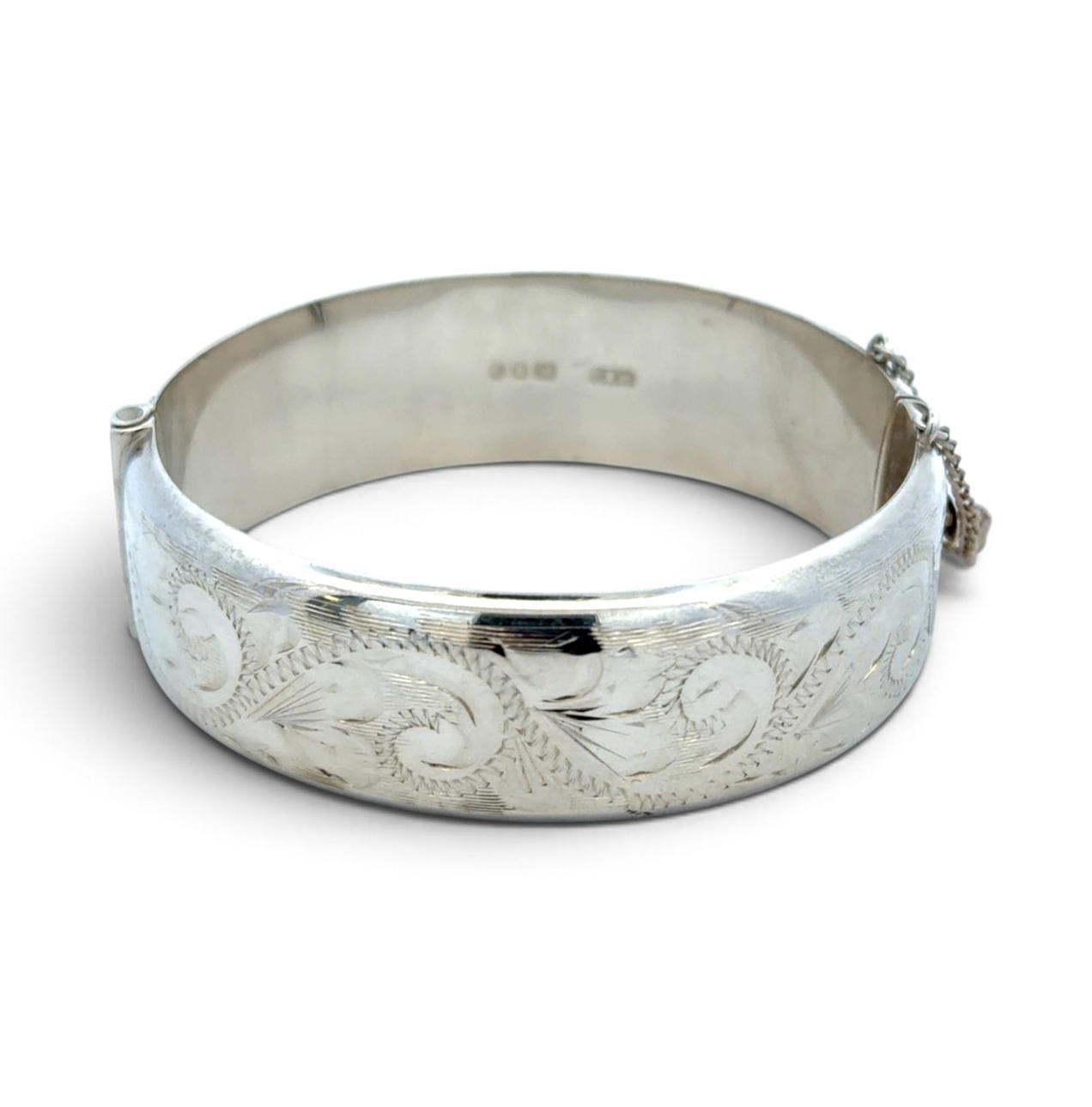 HINGED SILVER BANGLE.