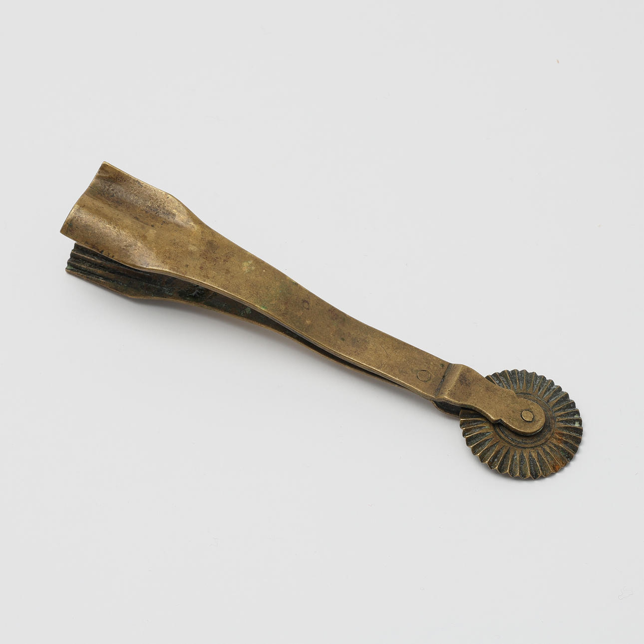 PASTRY JIGGER, brass, 17th-18th century.